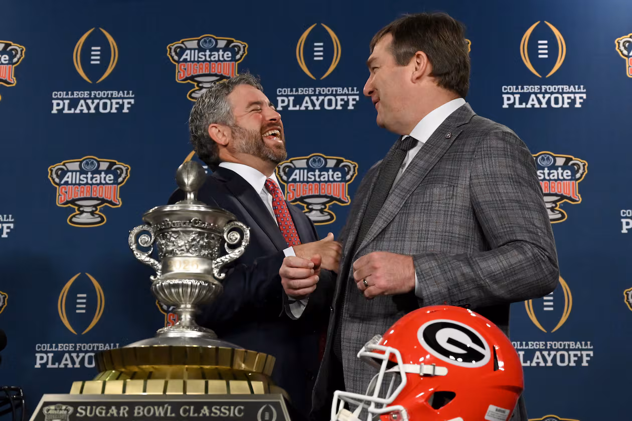 Georgia head coach Kirby Smart and Ole Miss head coach Pete Golding interact at a press conference ahead of the Sugar Bowl on Wednesday, Dec. 31, 2025, in New Orleans. (Hyosub Shin/AJC)