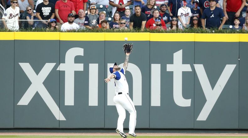 ATLANTA, GA - AUGUST 18: Left fielder Matt Adams #18 of the Atlanta Braves makes a running catch in the first inning during the game against the Cincinnati Reds at SunTrust Park on August 18, 2017 in Atlanta, Georgia. (Photo by Mike Zarrilli/Getty Images)