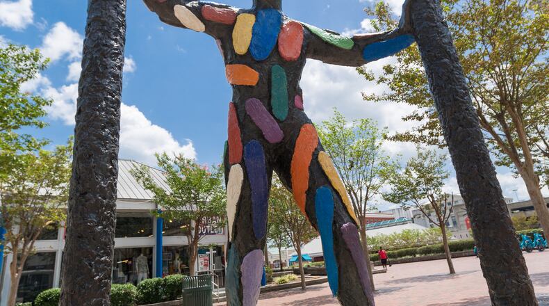 The bronze statue 'Threshold' created by Barcelona artist Robert Llimos was installed for The Olympics in 1996 and is found at Peachtree and Wall Streets in the Underground Atlanta Festival Plaza. (Jenni Girtman / Atlanta Event Photography)