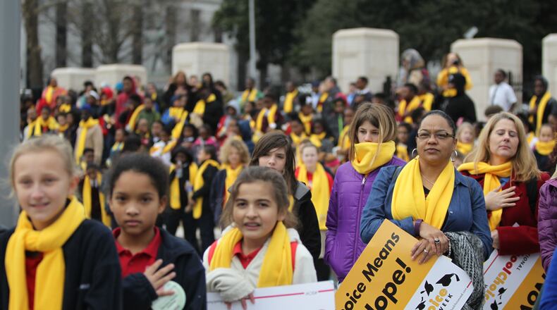 January 25, 2016 Atlanta - The crowd listens to the national anthem at the school choice rally. The rally took place at the state Capitol, and highlighted legislation aimed at expanding charter schools and other school choice options in Georgia.TAYLOR CARPENTER / TAYLOR.CARPENTER@AJC.COM