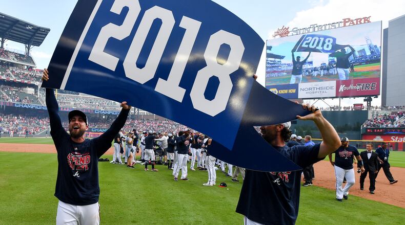 The Atlanta Braves celebrate after clinching their division against the Philadelphia Phillies at SunTrust Park Saturday September 22, 2018. Photo by Brant Sanderlin/AJC