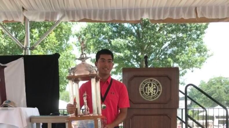 Defending Champion Lloyd Jefferson Go stands with his trophy after the 2017 Dogwood Invitational. Go is currently tied for 44th.