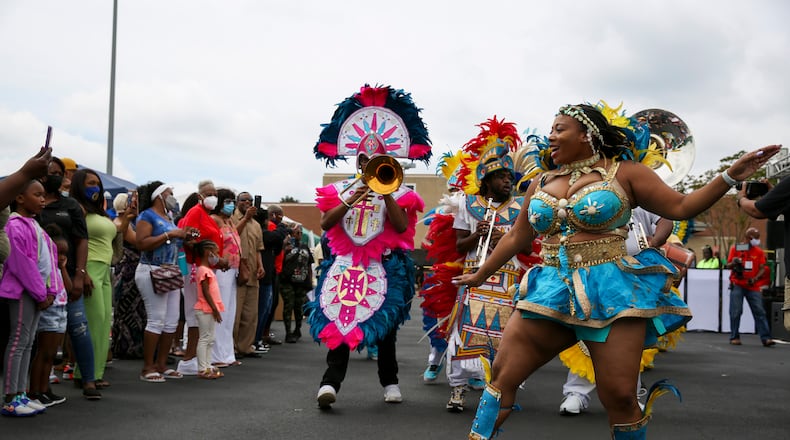 Members of the Atlanta Junkanoo perform at the New Black Wall Street Market's dedication event in Stonecrest, Georgia, on Saturday, May 29, 2021. (Rebecca Wright for the Atlanta Journal-Constitution)