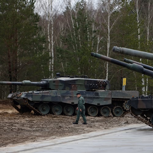 FILE - A Polish soldier walks next to the Leopard 2 tanks during a training at a military base and test range in Swietoszow, Poland, Monday, Feb. 13, 2023. (AP Photo/Michal Dyjuk, File)