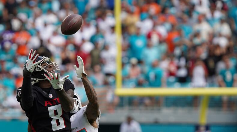 Falcons tight end Kyle Pitts (8) makes a catch as Miami Dolphins cornerback Xavien Howard (25) defends during the second half Sunday, Oct. 24, 2021, in Miami Gardens, Fla. (Hans Deryk/AP)