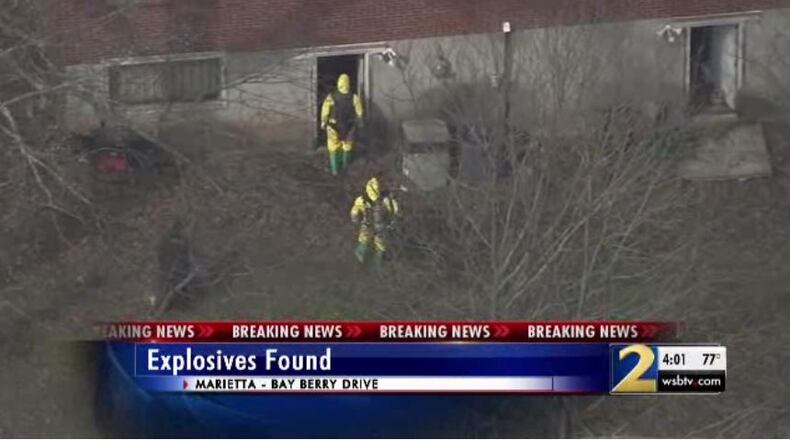 Authorities found pipe bombs and other weapons in the house.