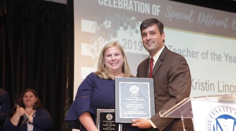 MCS Teacher of the Year for 2019 Kristin Lincoln, left, poses with superintendent Grant Rivera
