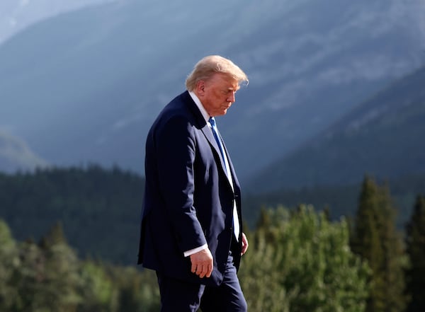 U.S. President Donald Trump leaves after a family photo session during the G7 Summit, in Kananaskis, Alberta, Monday, June 16, 2025. (Suzanne Plunkett/Pool Photo via AP)