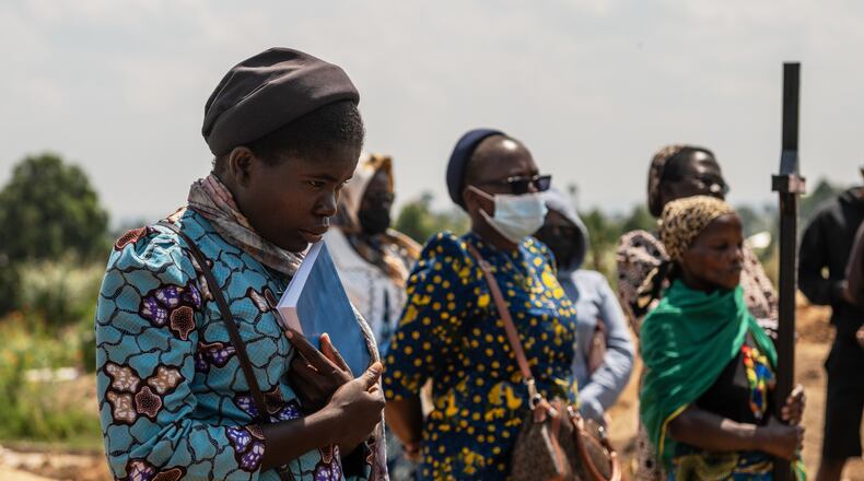 Catholic nuns from the orphanage where Vanisa Anifa, a 6-month-old orphaned girl who died of Ebola, was staying, attends her funeral in Bunia, Congo, Friday, June 19, 2026. (AP Photo/Moses Sawasawa)