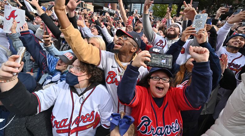 November 5, 2021 Atlanta - Braves and fans celebrate the team's World Series win during the parade at the Battery Atlanta on Friday, November 5, 2021. Atlanta is partying on Friday like it’s 1995, the last time the Atlanta Braves were World Series champions. The Atlanta Journal-Constitution is offering live updates from the Braves parade route in downtown Atlanta, Cobb County and inside Truist Park. (Hyosub Shin / Hyosub.Shin@ajc.com)