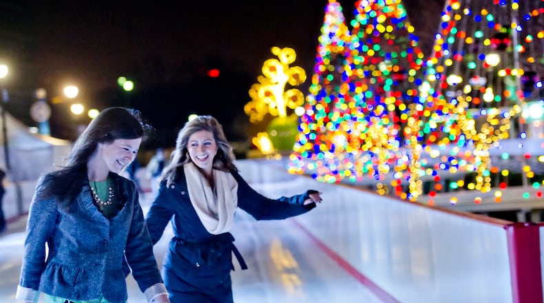 Maggie Daley (left) and Ashlyn Stallings ice skate at Atlantic Station in Midtown. JONATHAN PHILLIPS / SPECIAL