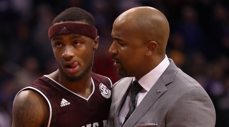 Duane Wilson of the Texas A&M Aggies walks off the court with assistant coach Amir Abdur-Rahim after being defeated by the Arizona Wildcats in the college basketball game at Talking Stick Resort Arena on Dec. 5, 2017 in Phoenix, Arizona.