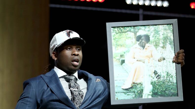 Takkarist McKinley of UCLA reacts after being picked 26th overall by the Falcons during the first round of the NFL draft Thursday night at the Philadelphia Museum of Art. (Photo by Elsa/Getty Images)