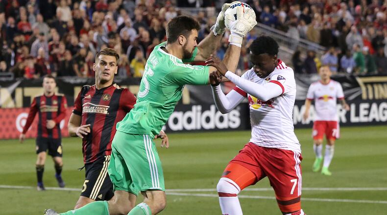 Atlanta United RC N.Y. goalkeeper Alec Kann blocks a shot by Red Bulls Derrick Etienne during the second half in the first game in franchise history on Sunday, March 5, 2017, in Atlanta. Curtis Compton/ccompton@ajc.com