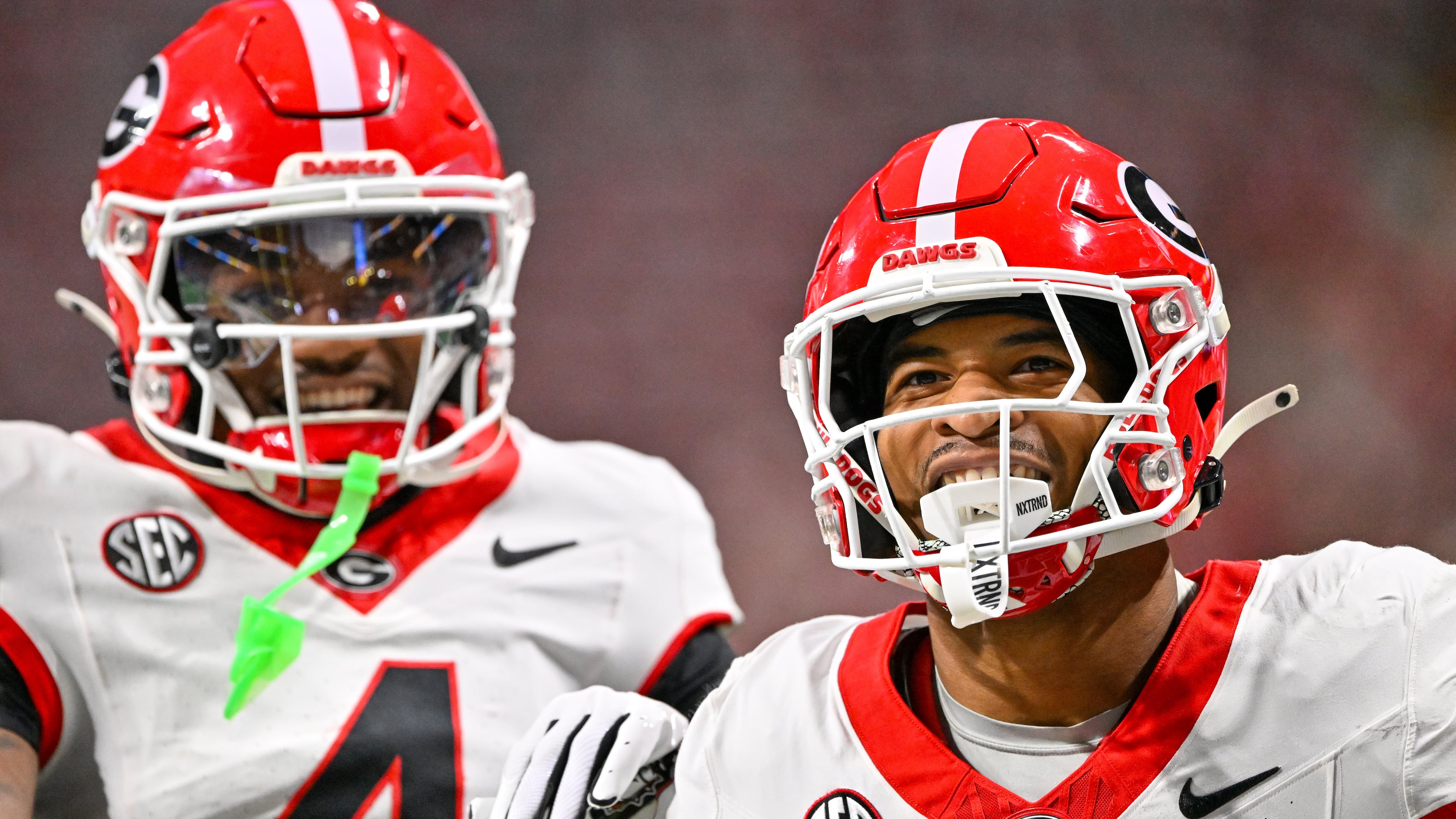 Georgia defensive back Daylen Everette (6)) celebrates with Kj Bolden (4) after intercepting a pass from Alabama quarterback Ty Simpson during the first half of the SEC Championship game at Mercedes-Benz Stadium, Saturday, Dec. 6, 2025, in Atlanta. (Hyosub Shin / AJC)