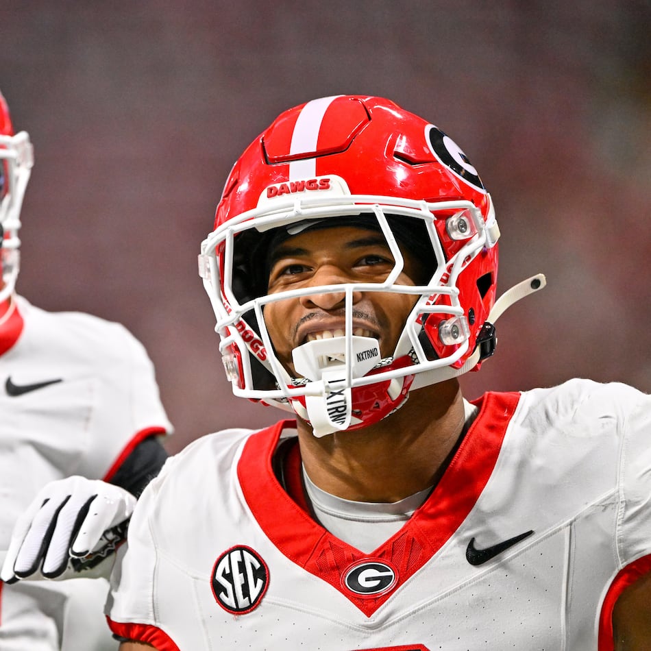 Georgia defensive back Daylen Everette (6)) celebrates with Kj Bolden (4) after intercepting a pass from Alabama quarterback Ty Simpson during the first half of the SEC Championship game at Mercedes-Benz Stadium, Saturday, Dec. 6, 2025, in Atlanta. (Hyosub Shin / AJC)