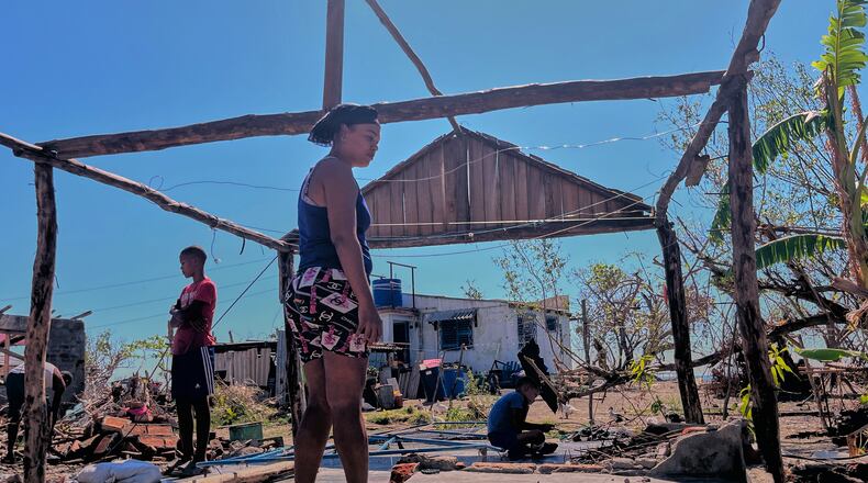 Elizandra Sorrilla poses for a photo in the ruins of her home, which was destroyed by Hurricane Melissa, in El Aserradero, Cuba, Sunday, Nov. 16, 2025. (AP Photo/Milexsy Duran)