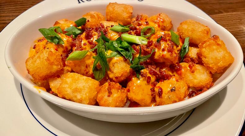 The tots at Roshambo are served disco-style, with a pimento cheese Mornay sauce. Angela Hansberger for The Atlanta Journal-Constitution