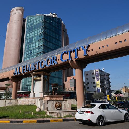 Cars pass next to Habtoor hotel, left, in Beirut, Lebanon, Monday, Jan. 26, 2026. (AP Photo/Hassan Ammar)