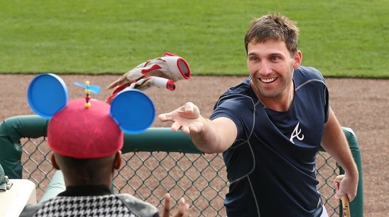 022516 LAKE BUENA VISTA: Braves outfielder Jeff Francoeur tosses his batting gloves to 7-year-old Keion Mathis during spring training at Champion Stadium on Thursday, Feb 25, 2016, at the ESPN Wide World of Sports, Lake Buena Vista, FL.  Curtis Compton / ccompton@ajc.com