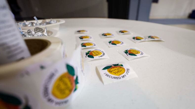 Voting stickers are placed and ready to be handed out at Calvary Baptist Church in Austell during the special election in June. (Miguel Martinez/AJC)