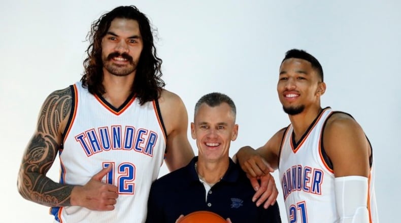 Oklahoma City Thunder head coach Billy Donovan, center, poses for a photo with center Steven Adams, left, and guard Andre Roberson, right, during the 2016-2017 Oklahoma City Thunder Media Day in Oklahoma City. (AP Photo/Sue Ogrocki)