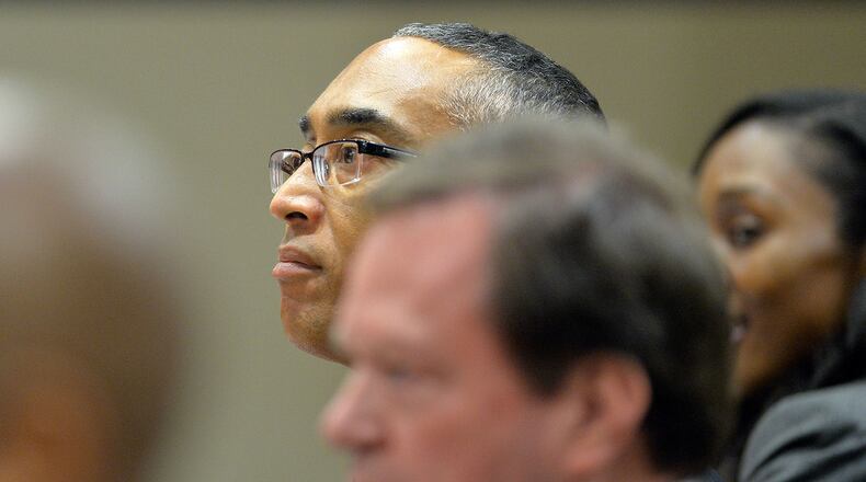 DeKalb County CEO Burrell Ellis listens as the jury is sworn in Tuesday, June 9, 2015.