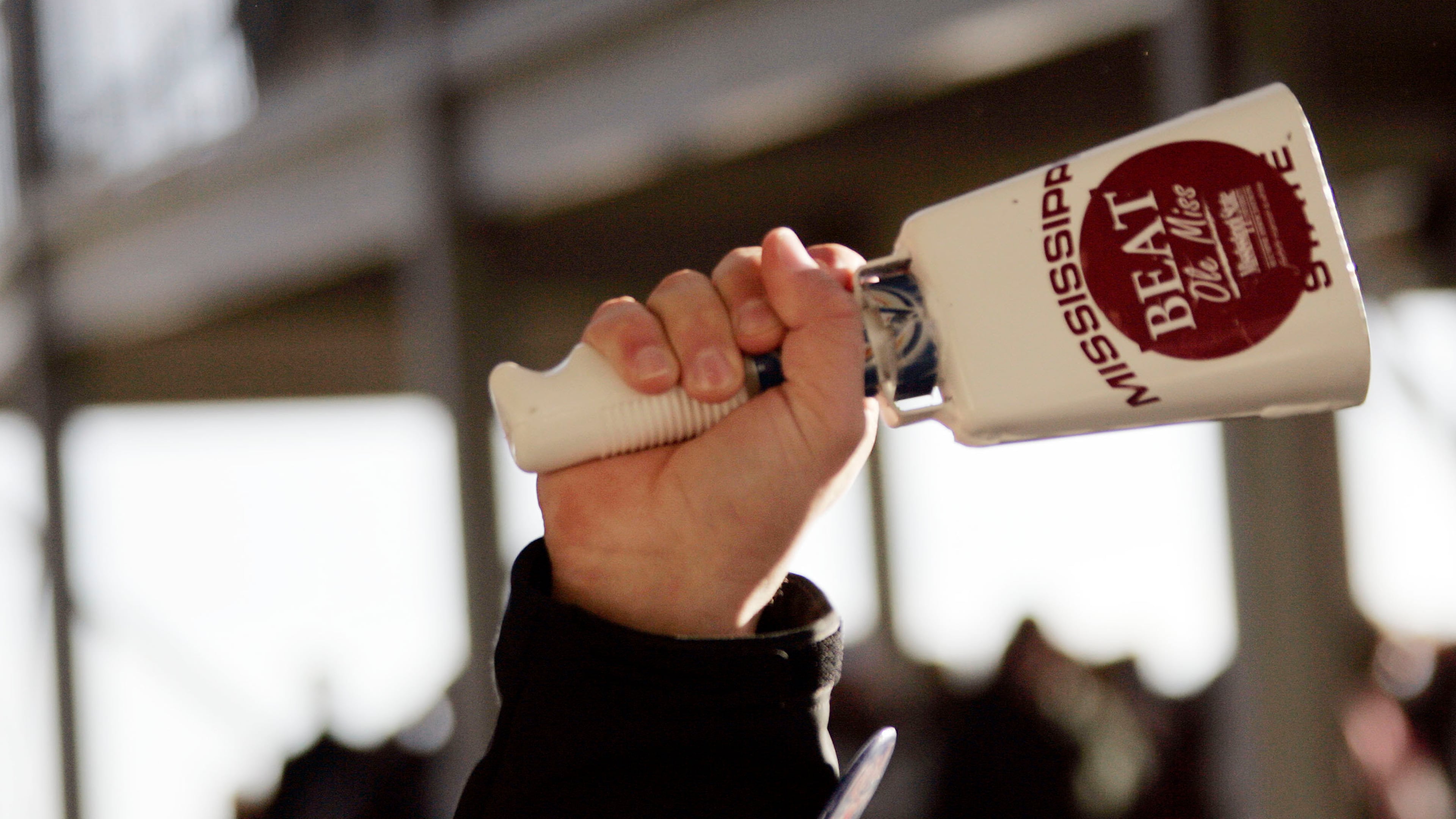 A Mississippi State fan rings a cowbell, a unique part of the experience for teams playing in Starkville. (Rogelio V. Solis/AP)