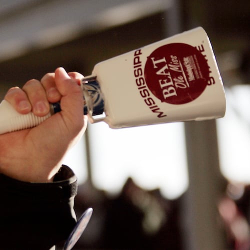A Mississippi State fan rings a cowbell, a unique part of the experience for teams playing in Starkville. (Rogelio V. Solis/AP)