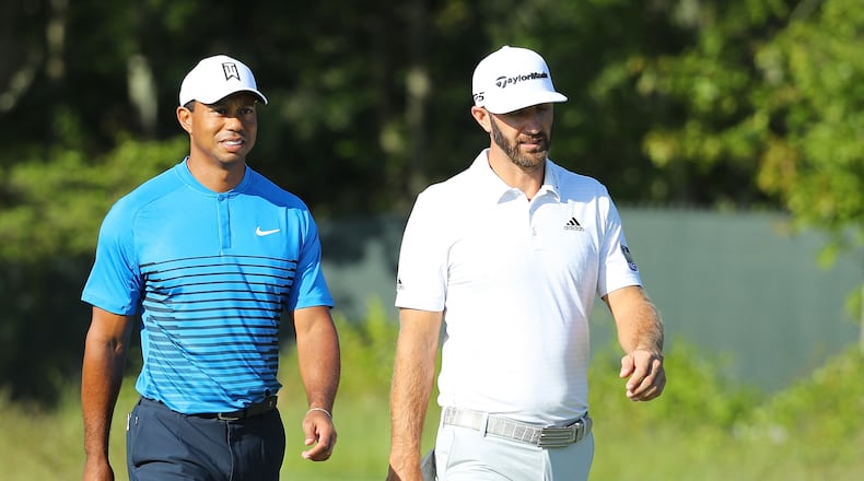 A new power couple sighted at the U.S. Open: Tiger Woods and Dustin Johnson walk it off during a Tuesday practice round at Shinnecock Hills. (Warren Little/Getty Images)