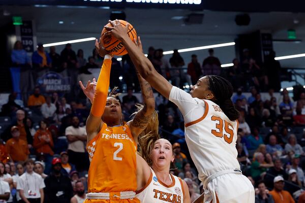 Texas forward Madison Booker (35) blocks the shot attempt of Tennessee guard Ruby Whitehorn (2) during the first half in the Sweet 16 of the NCAA college basketball tournament, Saturday, March 29, 2025, in Birmingham, Ala. (AP Photo/Butch Dill)