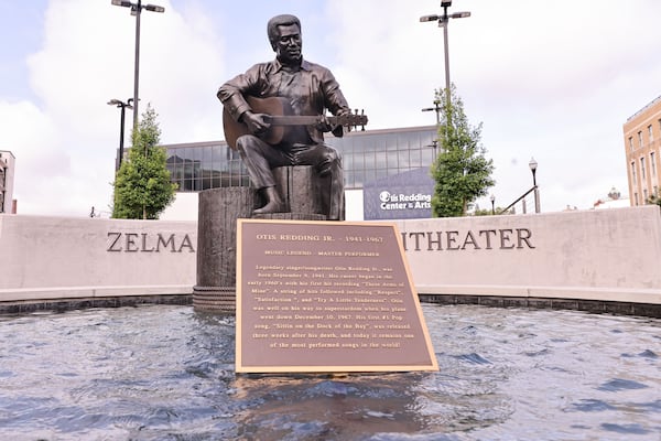 The Otis Redding statue in downtown Macon is now perched on bronze dock pilings in front of an outdoor venue that bears his widow's name, the Zelma Redding Amphitheater. (Natrice Miller/ AJC)