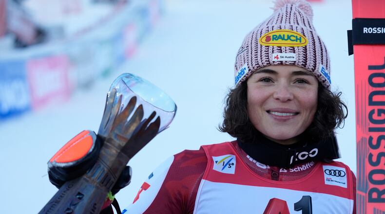 Austria's Julia Scheib celebrates winning an alpine ski, women's World Cup giant slalom, in Semmering, Austria, Saturday, Dec. 27, 2025. (AP Photo/Giovanni Auletta)
