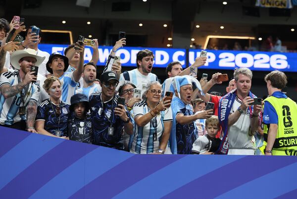 Argentina fans cheer as their team appears on the pitch before the start of Argentina vs. England FIFA World Cup Semifinal match at Atlanta Stadium (Mercedes-Benz Stadium) on Wednesday, July 15, 2026.  (Jason Getz/AJC)