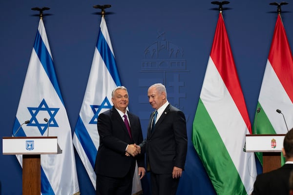 Hungarian Prime Minister Viktor Orban, left, and Israeli Prime Minister Benjamin Netanyahu shake hands after a press statement at the Carmelite Monastery in the Buda Castle in Budapest, Hungary, Thursday, April 3, 2025. (AP Photo/Denes Erdos)