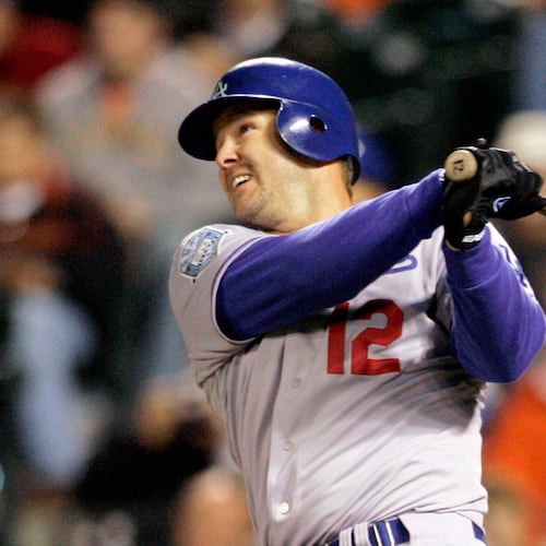 FILE - Los Angeles Dodgers Jeff Kent hits a two-run home run against the San Francisco Giants in the fourth inning of a baseball game in San Francisco, Sept. 26, 2008. (AP Photo/Jeff Chiu, File)