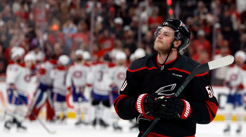 Carolina Hurricanes' Eric Robinson celebrates following Game 5 of the Eastern Conference finals NHL hockey Stanley Cup playoff series against the Montreal Canadiens in Raleigh, N.C., Friday, May 29, 2026. (AP Photo/Karl DeBlaker)