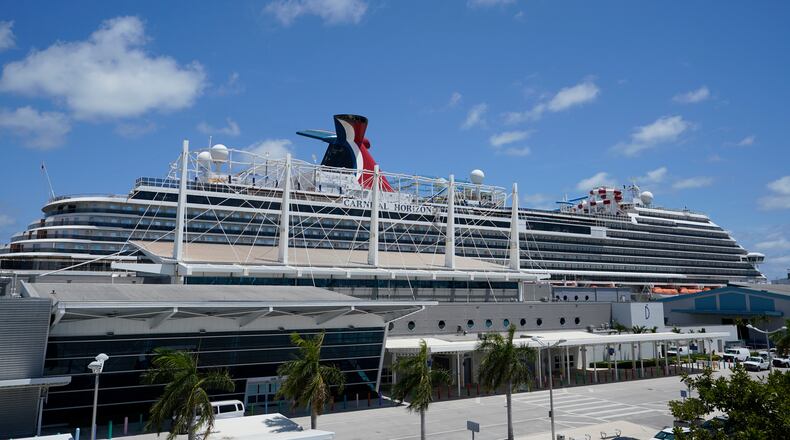 FILE - Carnival Cruise Line's Carnival Horizon cruise ship is shown docked at PortMiami, Friday, April 9, 2021, in Miami. (AP Photo/Wilfredo Lee,File)