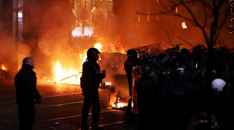 Police clash with protesters during a rally against austerity measures in next year's draft budget, in Sofia, Monday, Dec 1, 2025. (AP Photo/Valentina Petrova)