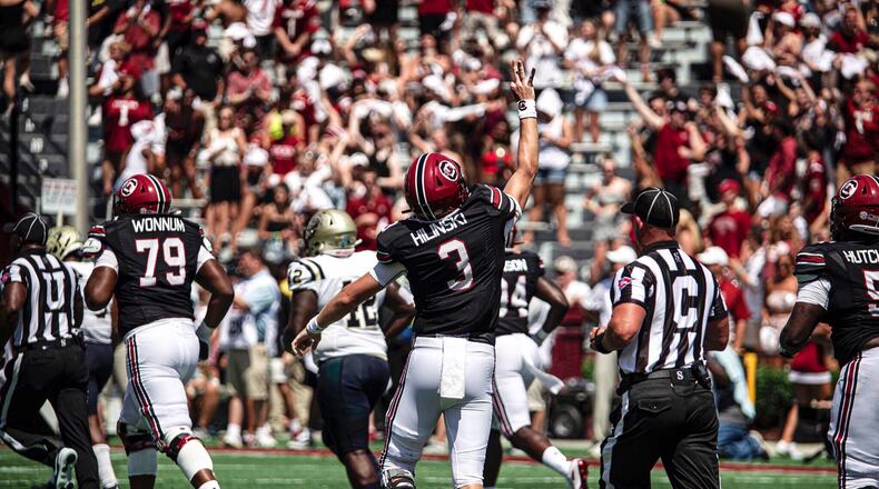 South Carolina quarterback Ryan Hilinski raises three fingers to honor his late brother Tyler, who was the starting quarterback at Washington State when died as a result of suicide in 2017.