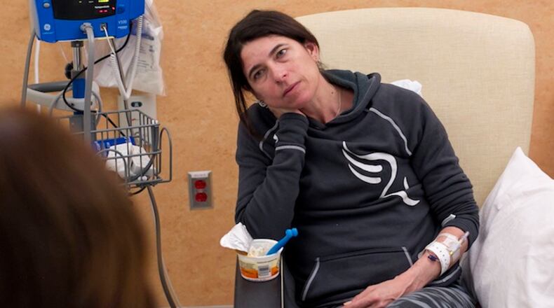 Amy Charney takes a chemotherapy infusion at the NC Cancer Hospital in Chapel Hill on October 22, 2015, in Chapel Hill, N.C. Charney was diagnosed with breast cancer in November 2014. The visits to the hospital for treatment can take as long as five hours. (Robert Willett/Raleigh News & Observer/TNS)