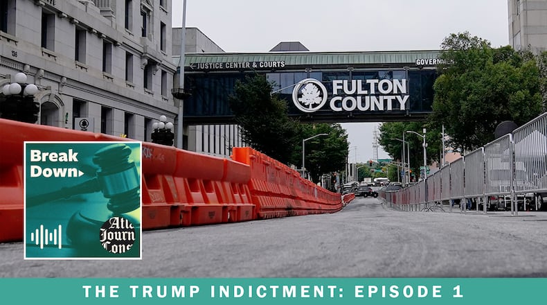 Barricades are erected in front of the Fulton County courthouse, in anticipation of possible indictments in the investigation into whether former President Donald Trump and his allies meddled in the 2020 election in Georgia. The case is the subject the AJC's "Breakdown" podcast, now beginning its tenth season. (Brynn Anderson / AP)