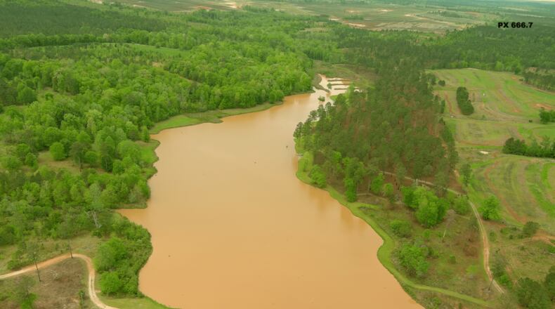 An aerial photo captured on April 9, 2023 shows a lake on the property of Shaun and Amie Harris in Stewart County, Georgia turned red by sediment runoff. (Courtesy of Shaun Harris)