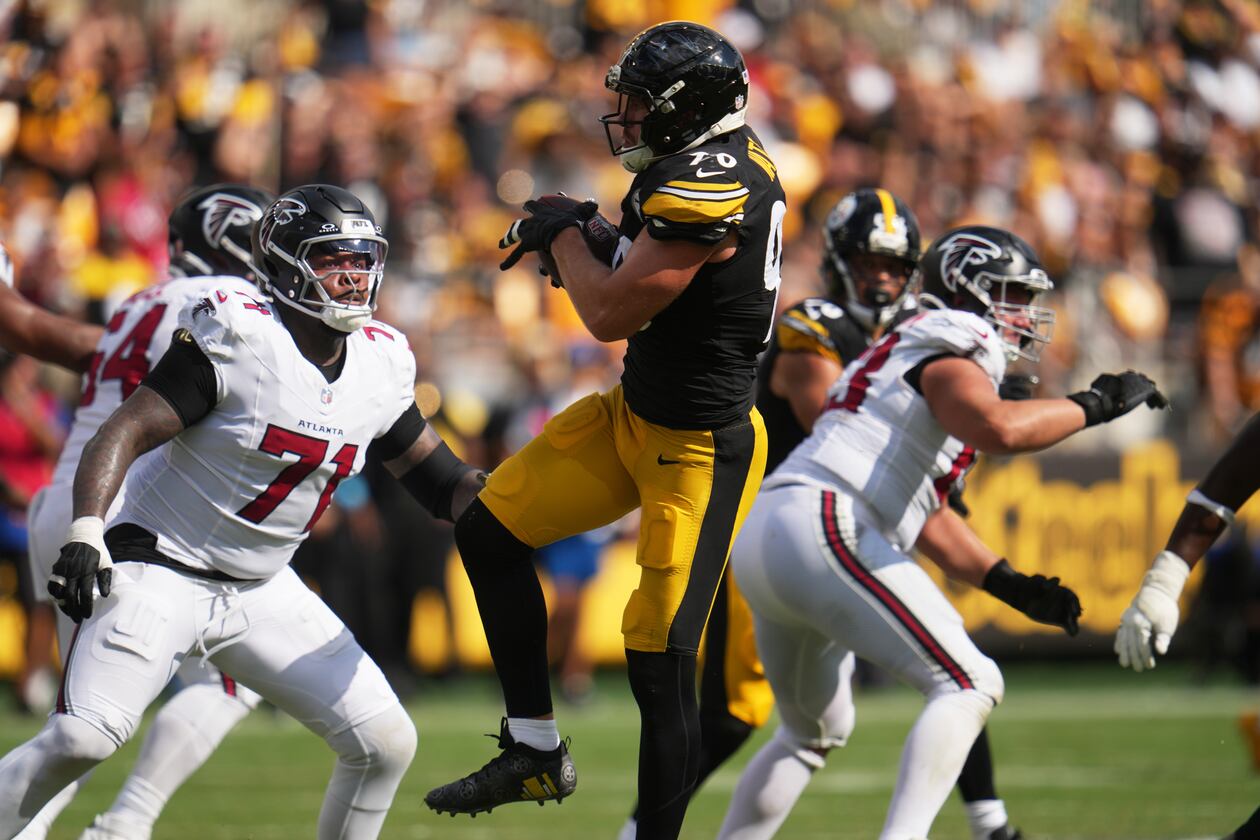 Pittsburgh Steelers outside linebacker T.J. Watt (center) intercepts a pass made by Atlanta Falcons quarterback Cooper Rush (right) during an NFL football game, Sunday, Sept. 13, 2026, in Pittsburgh. (Gene J. Puskar/AP)