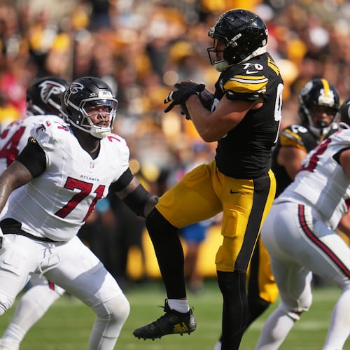 Pittsburgh Steelers outside linebacker T.J. Watt (center) intercepts a pass made by Atlanta Falcons quarterback Cooper Rush (right) during an NFL football game, Sunday, Sept. 13, 2026, in Pittsburgh. (Gene J. Puskar/AP)