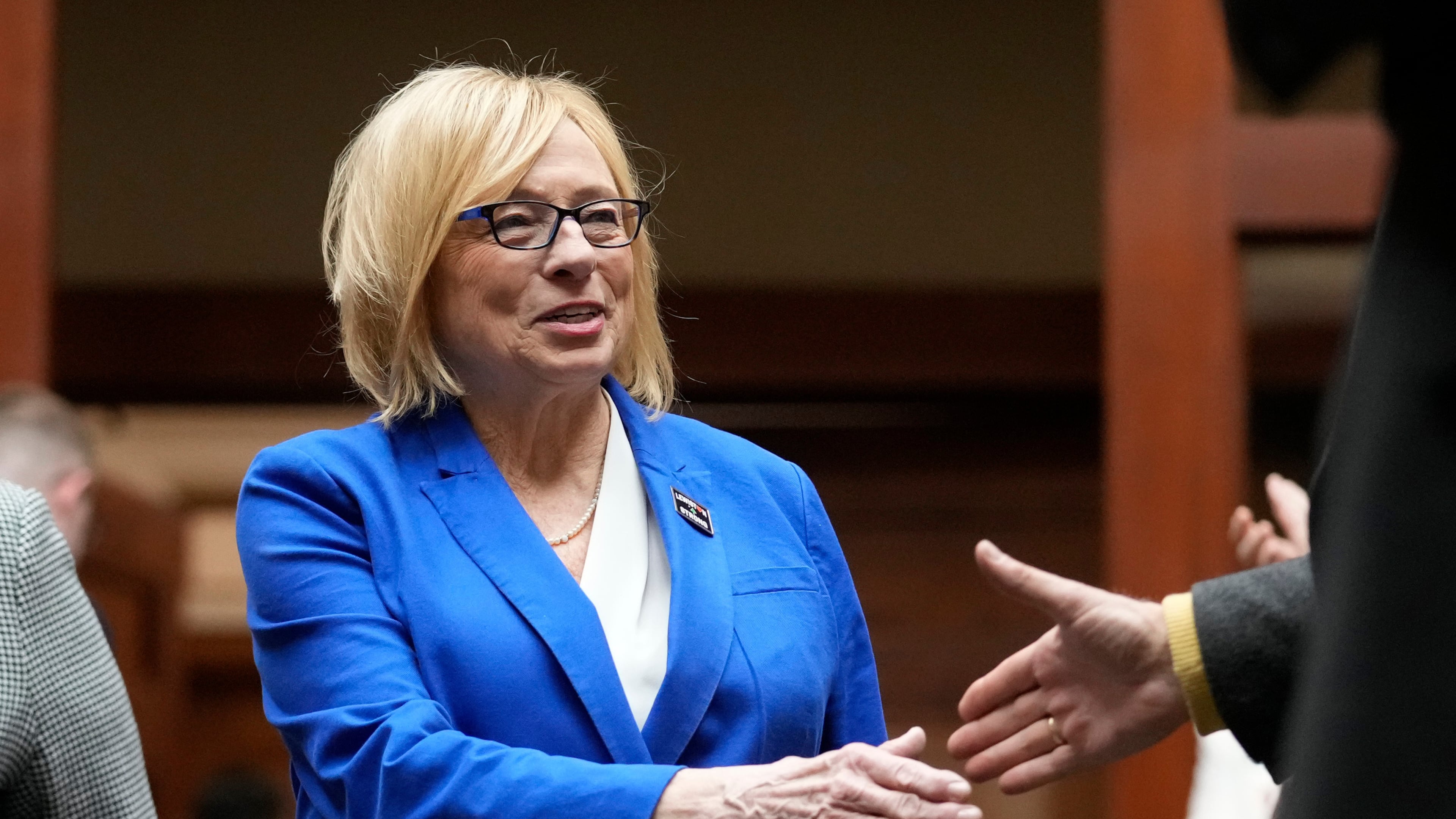FILE - Democratic Gov. Janet Mills, greets lawmakers prior to delivering her State of the State address, Jan. 30, 2024, at the State House in Augusta, Maine. (AP Photo/Robert F. Bukaty, FIle)