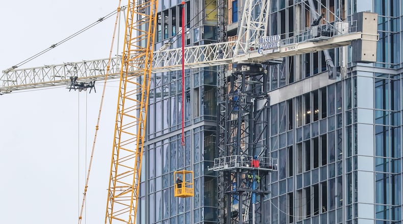 Residents were allowed to return home Friday after being evacuated from West Peachtree Street last week when a crane malfunctioned and became unstable.
