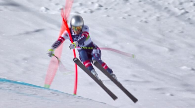 In this image taken from video provided by Olympic Broadcasting Services, OBS, United States' Lindsey Vonn crashes during an alpine ski women's downhill race, at the 2026 Winter Olympics, in Cortina d'Ampezzo, Italy, Sunday, Feb. 8, 2026. (Olympic Broadcasting Services via AP)