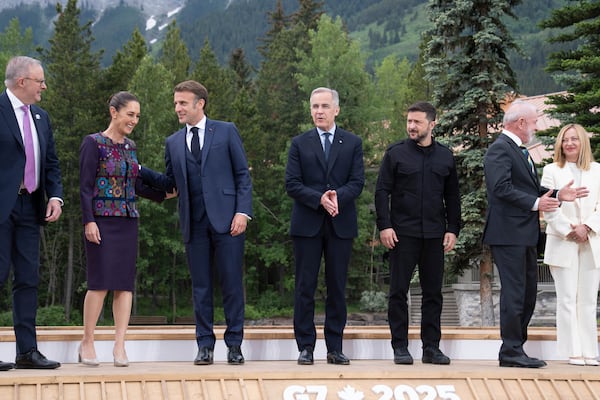 Australia's Prime Minister Anthony Albanese, from left, President of Mexico Claudia Sheinbaum, President of France Emmanuel Macron, Canada's Prime Minister Mark Carney, President of Ukraine Volodymyr Zelenskyy, President of Brazil Luiz Inacio Lula da Silva and Italy's Prime Minister Giorgia Meloni during a family photo at the G7 leaders' summit in Kananaskis, Alberta, Tuesday, June 17, 2025. (Stefan Rousseau/Pool Photo via AP)