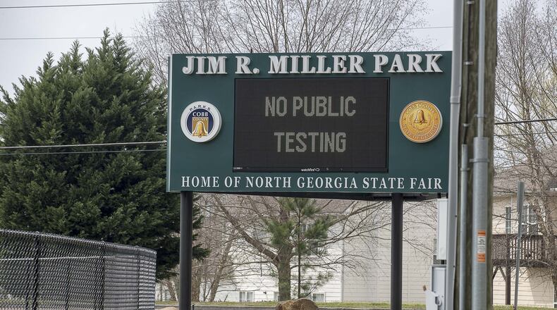 The Miller Park entrance sign informs citizens that the COVID-19 testing drive-thru is open at Miller Park in Marietta, Wednesday, March, 18, 2020. Testing is by “appointment” only and isn’t opened to the public unless with a medical referral. ALYSSA POINTER/ALYSSA.POINTER@AJC.COM